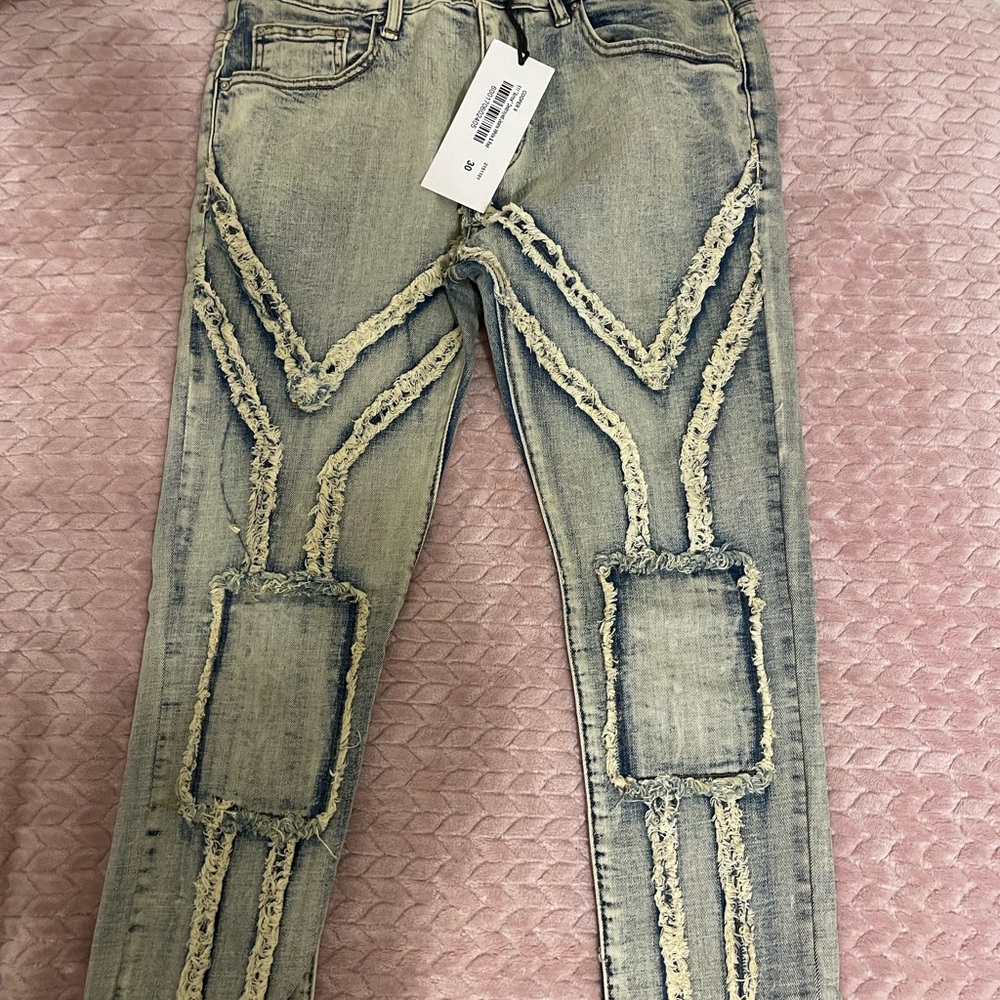 Distressed Blue Jeans with Unique Stitching